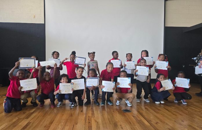  Students with certificates at honors ceremony